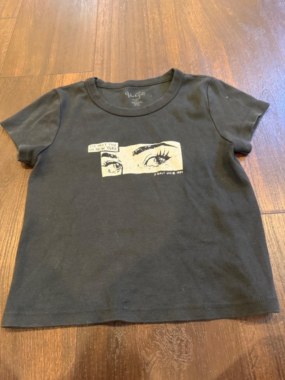 Brandy Melville Black Tee with Cream Eye Graphic